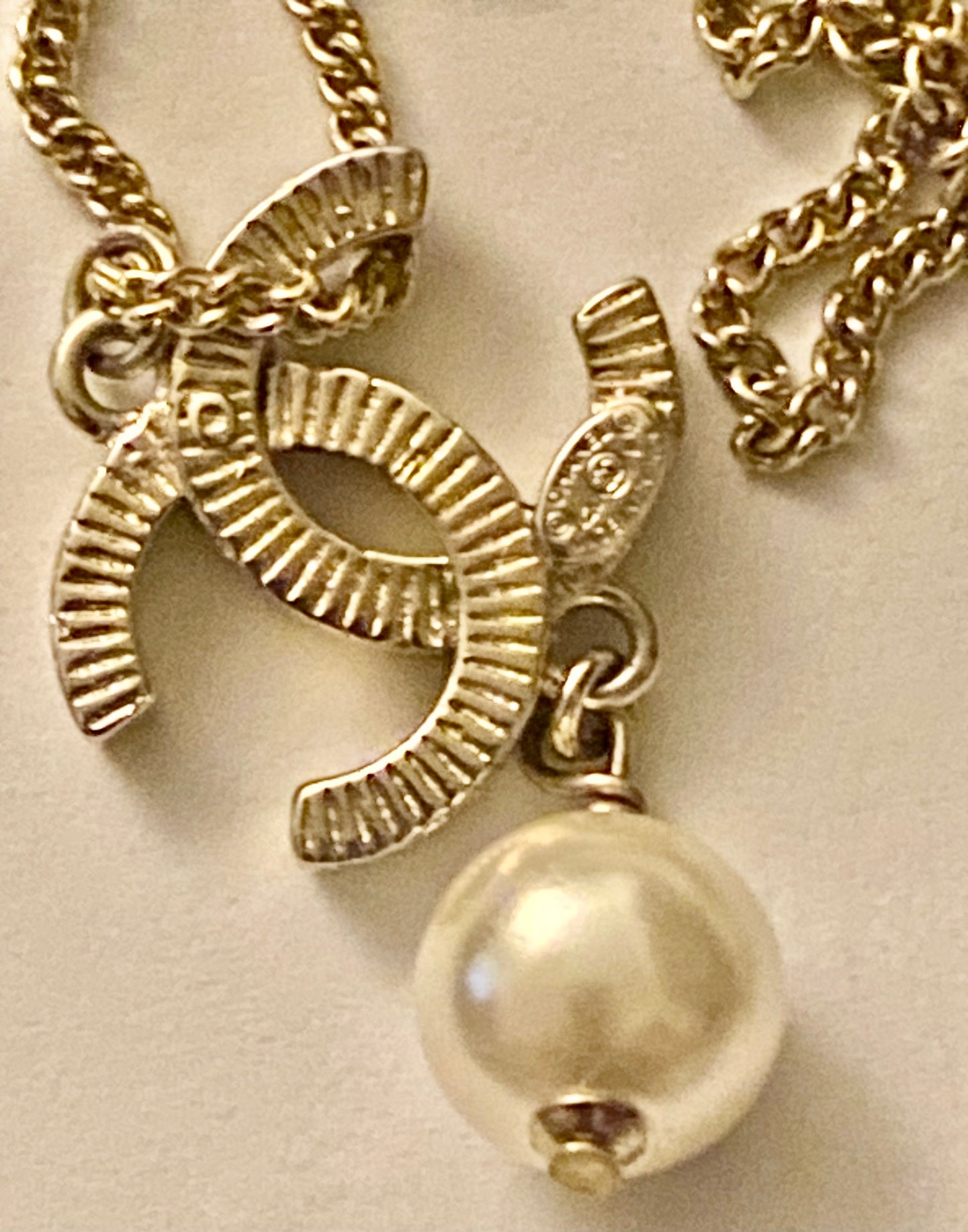 Authentic Chanel Pearl Logo Wave Black & Gold Necklace