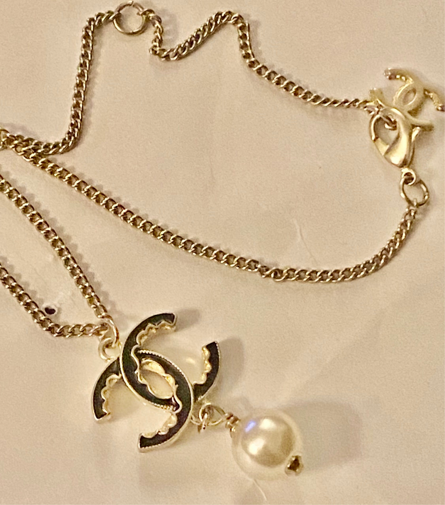 Authentic Chanel Pearl Logo Wave Black & Gold Necklace