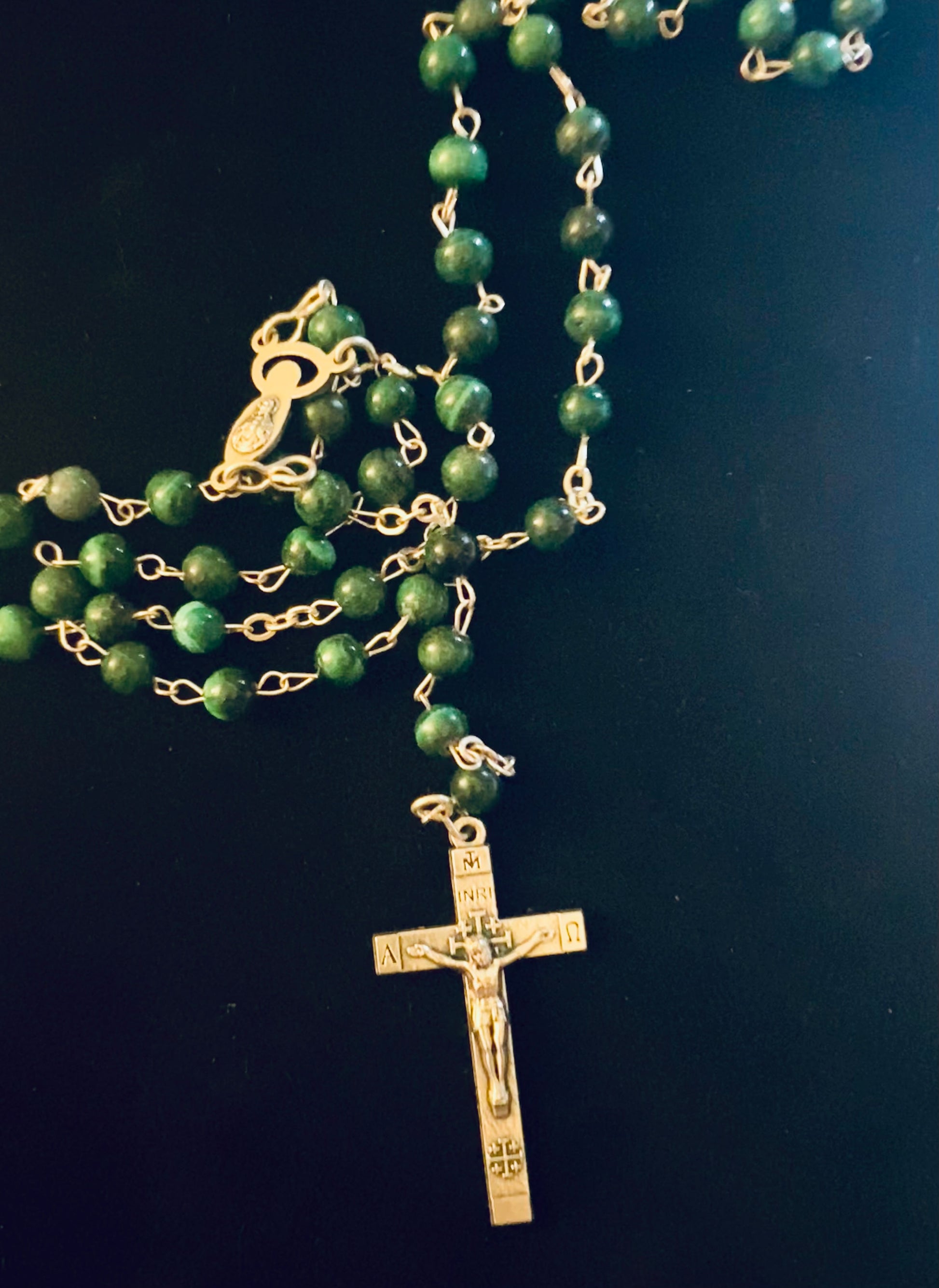 A Vintage Rosary Crucifix stamped on the back with Jerusalem. Beaded in Malachite with another mother Mary Pendant as well.