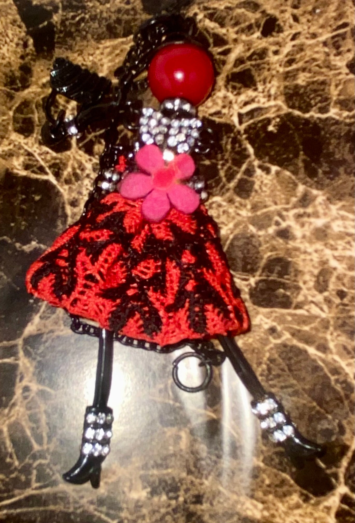 Whimsical doll necklace