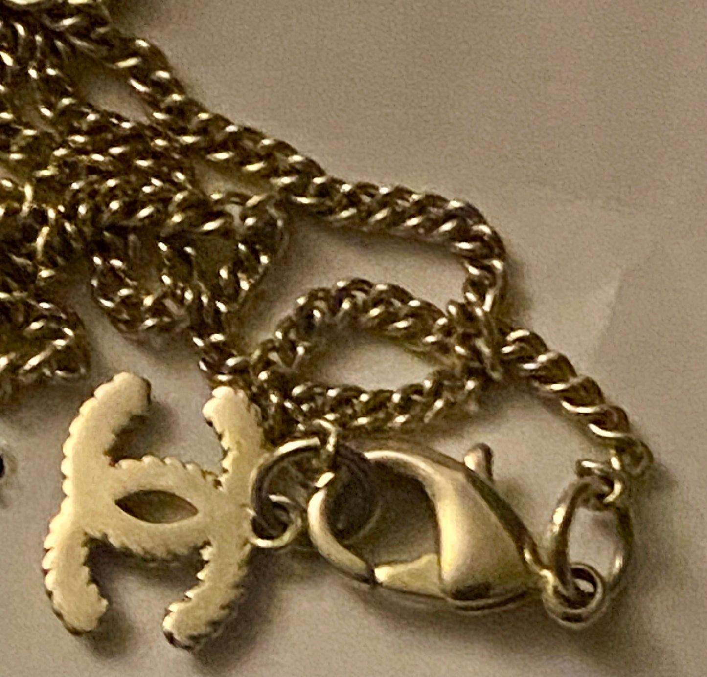 Authentic Chanel Pearl Logo Wave Black & Gold Necklace